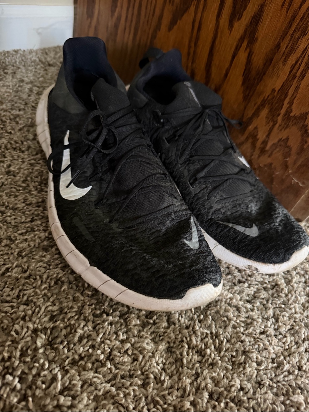 Nike Black Athletic Shoes with White Swoosh
